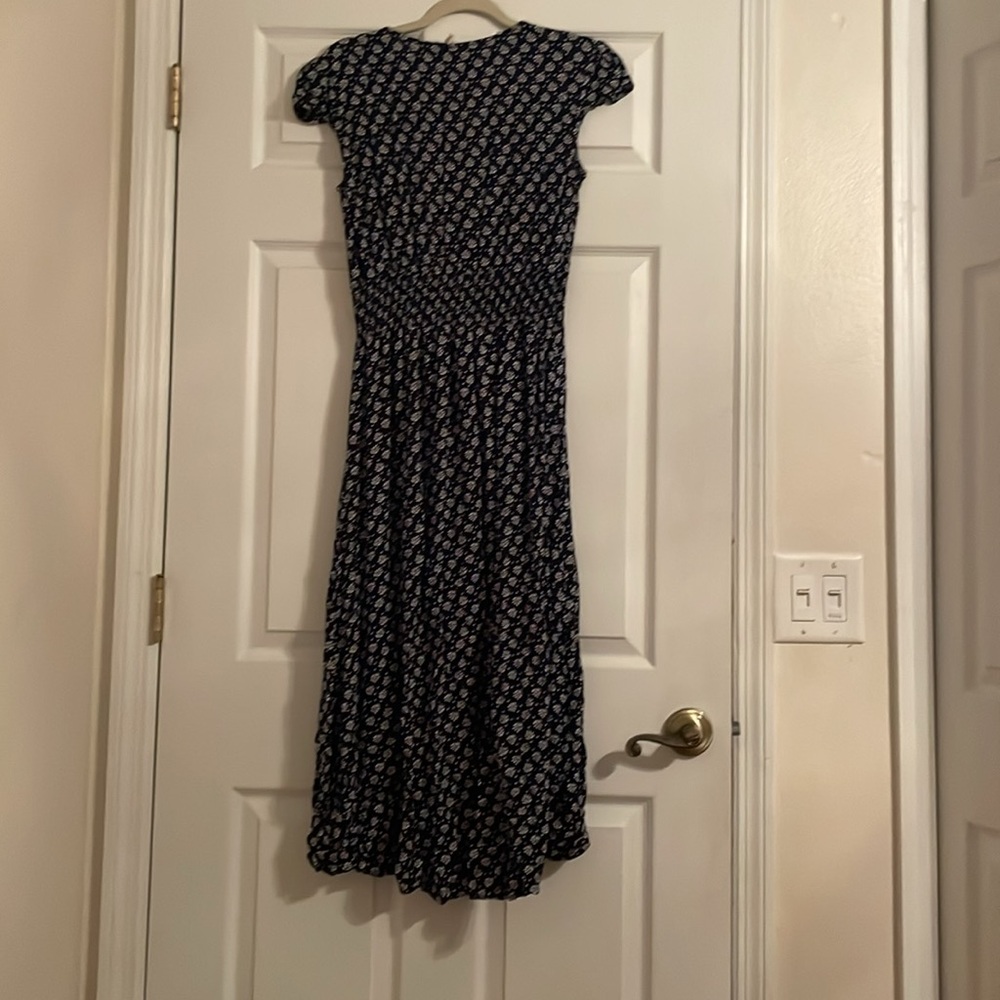 Navy Blue dress with little white designs, and white buttons. - Picture 2 of 3